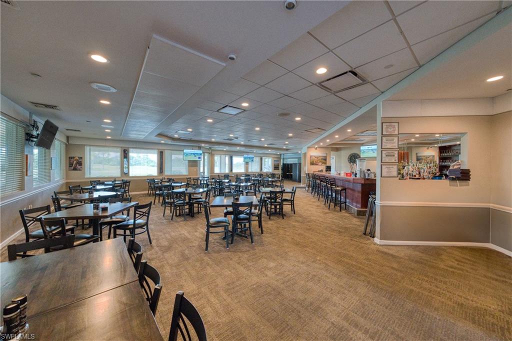 801 Islamorada Boulevard, Unit 22B Punta Gorda, FL 33955 - Photo 35 of 48 a room with lots of furniture and gym equipment