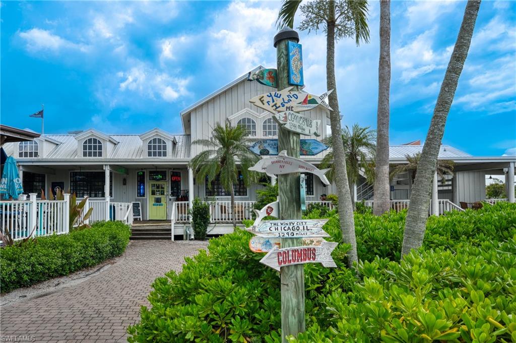 801 Islamorada Boulevard, Unit 22B Punta Gorda, FL 33955 - Photo 38 of 48 a front view of a house with a garden and plants