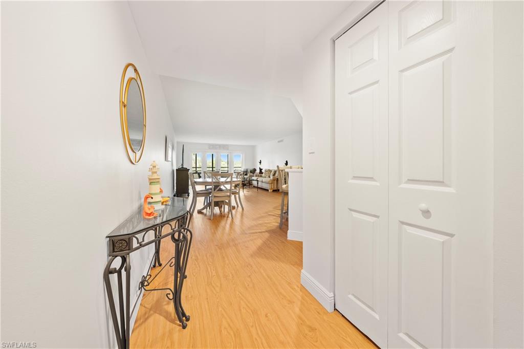 801 Islamorada Boulevard, Unit 22B Punta Gorda, FL 33955 - Photo 6 of 48 a view of a room with wooden floor and entryway