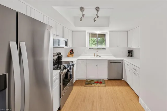 a kitchen with a sink and a window