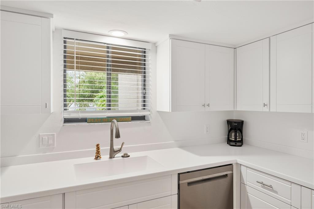 801 Islamorada Boulevard, Unit 22B Punta Gorda, FL 33955 - Photo 10 of 48 a kitchen with a sink and a window