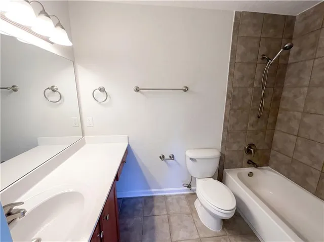 a kitchen with a stove a sink and a microwave