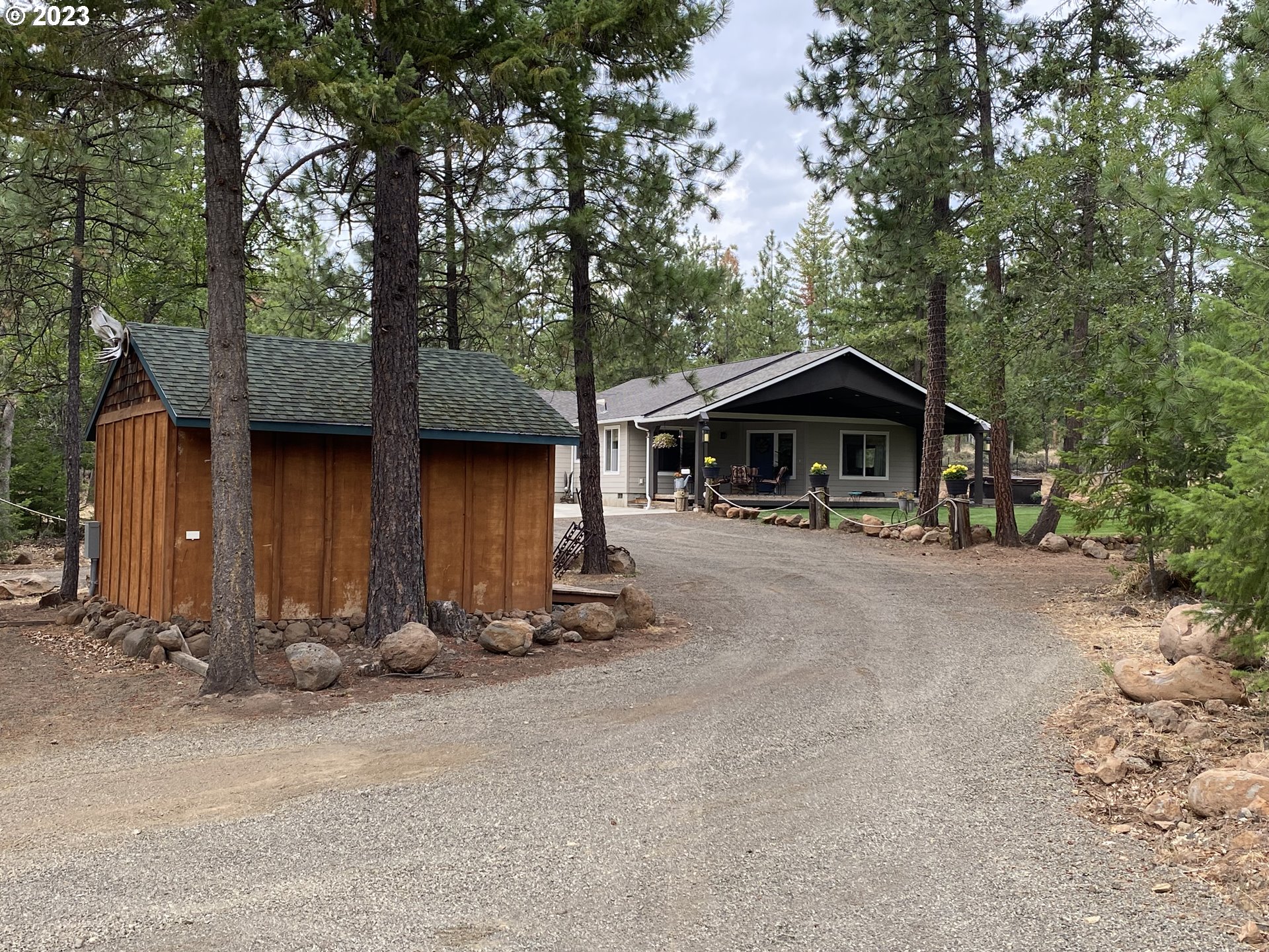 227 Locust Lane Goldendale, WA 98620 - Photo 17 of 48 a front view of a house with yard and trees