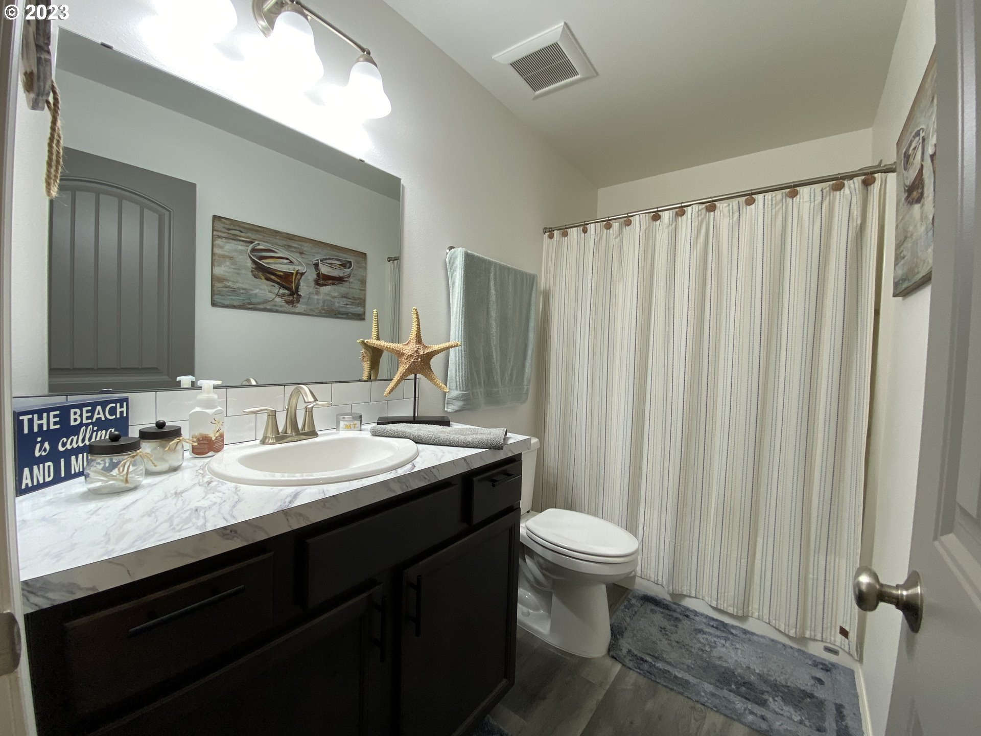 227 Locust Lane Goldendale, WA 98620 - Photo 22 of 48 a bathroom with a granite countertop sink toilet and a mirror