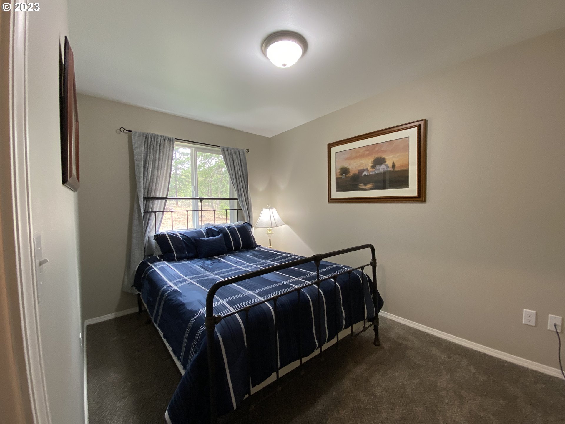 227 Locust Lane Goldendale, WA 98620 - Photo 23 of 48 a bedroom with a bed and window