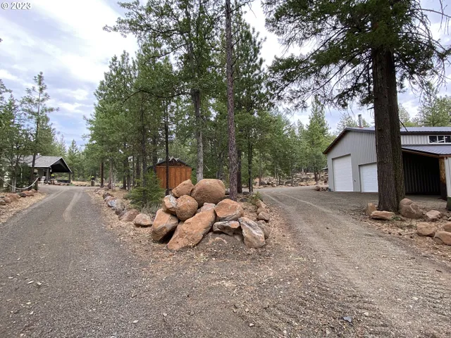 a view of a patio with table and chairs