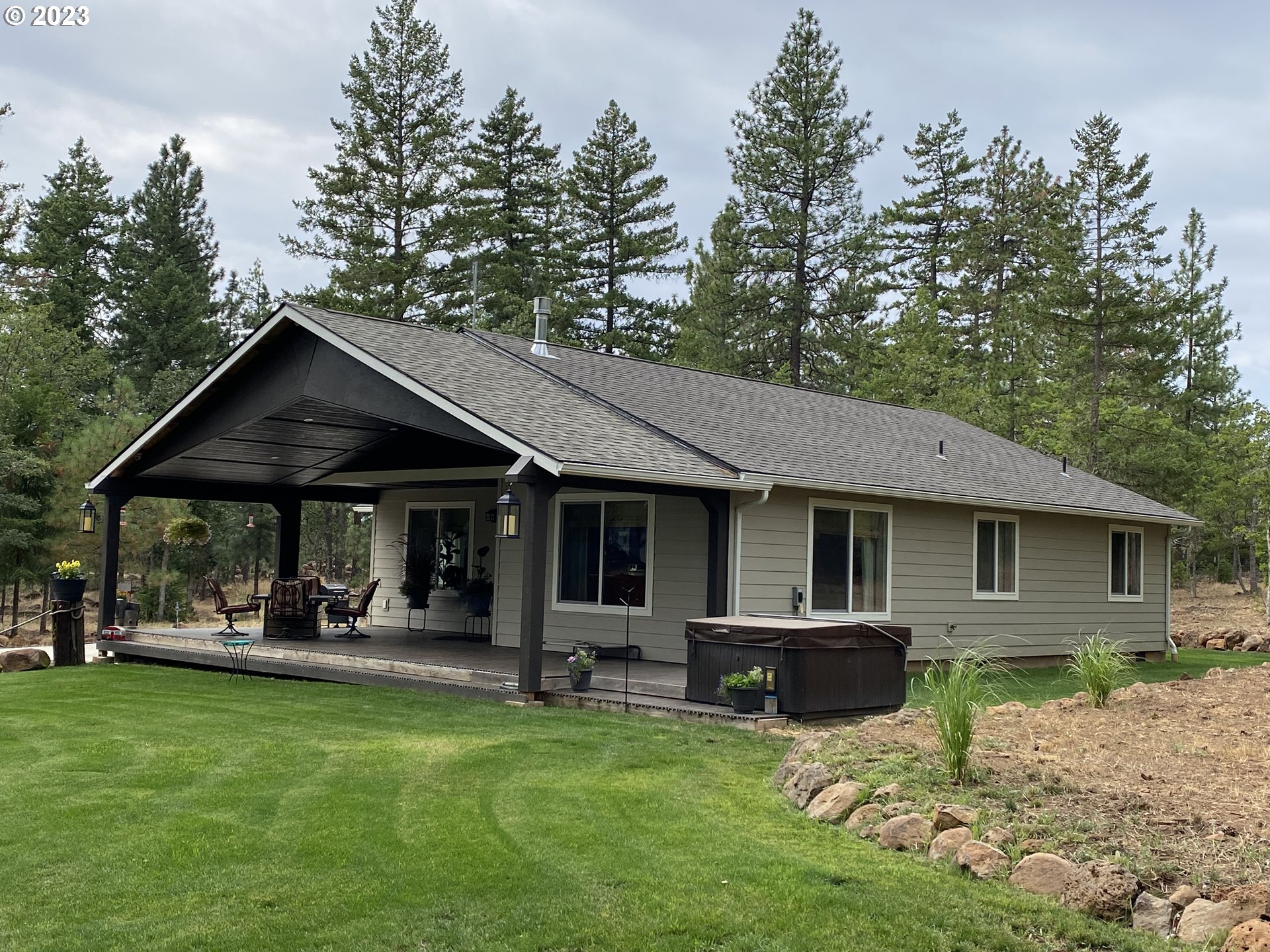227 Locust Lane Goldendale, WA 98620 - Photo 5 of 48 a view of a house with backyard porch and sitting area