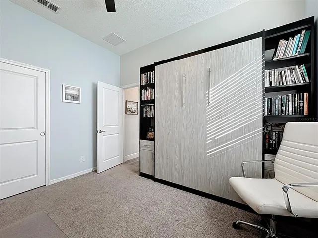 a view of room with closet and wooden floor