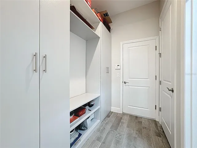 a view of parking garage with cars parked