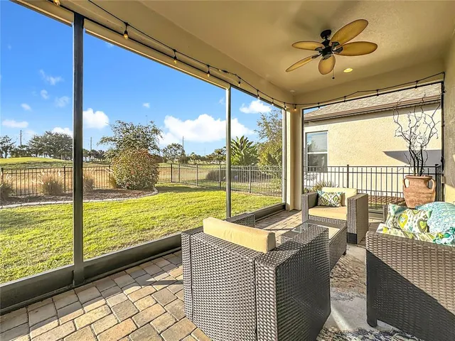 a view of a house with a yard and swimming pool
