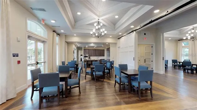 a view of a swimming pool with an outdoor seating