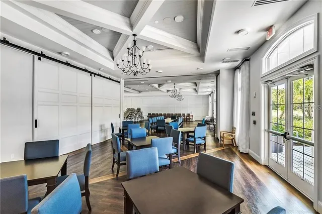 a view of swimming pool with outdoor seating and plants