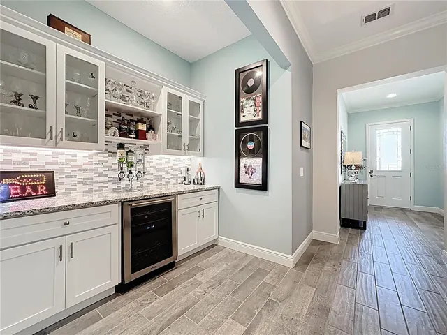 a kitchen with stainless steel appliances granite countertop a refrigerator and sink