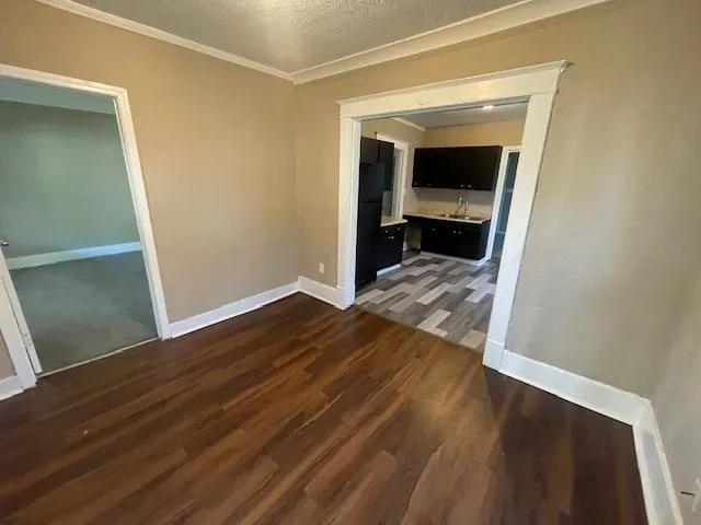 a view of living room with wooden floor