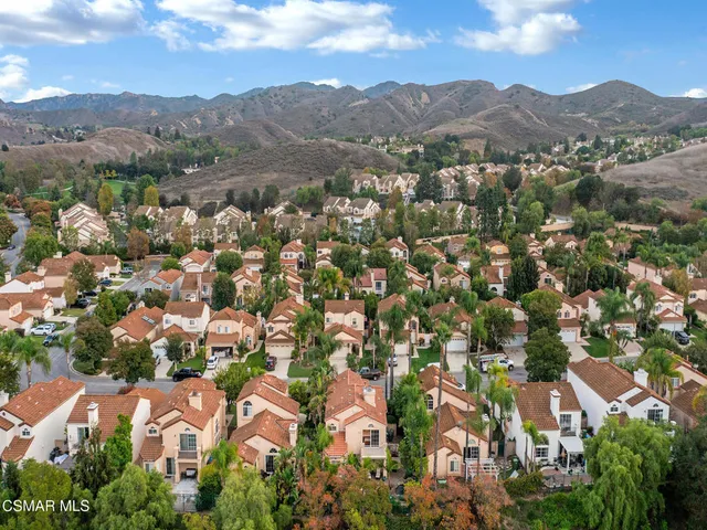 a view of a garden with a building in the background