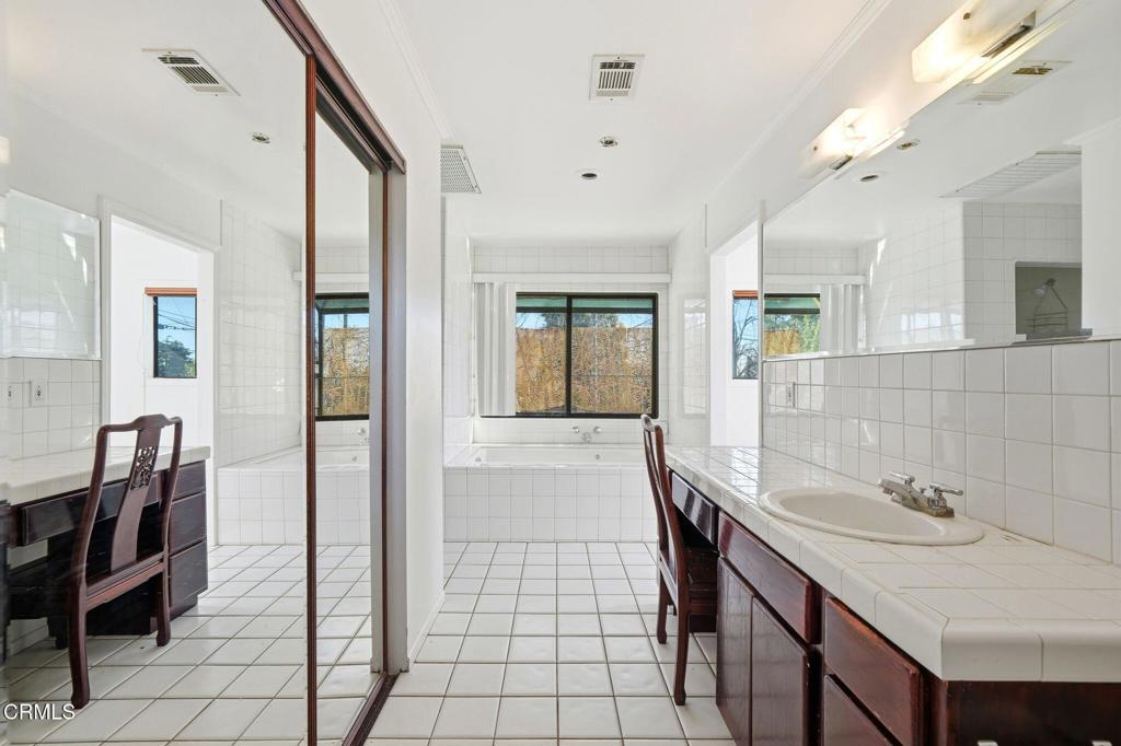 672 West Mendocino Street Altadena, CA 91001 - Photo 26 of 33 a bathroom with a sink a toilet and mirror