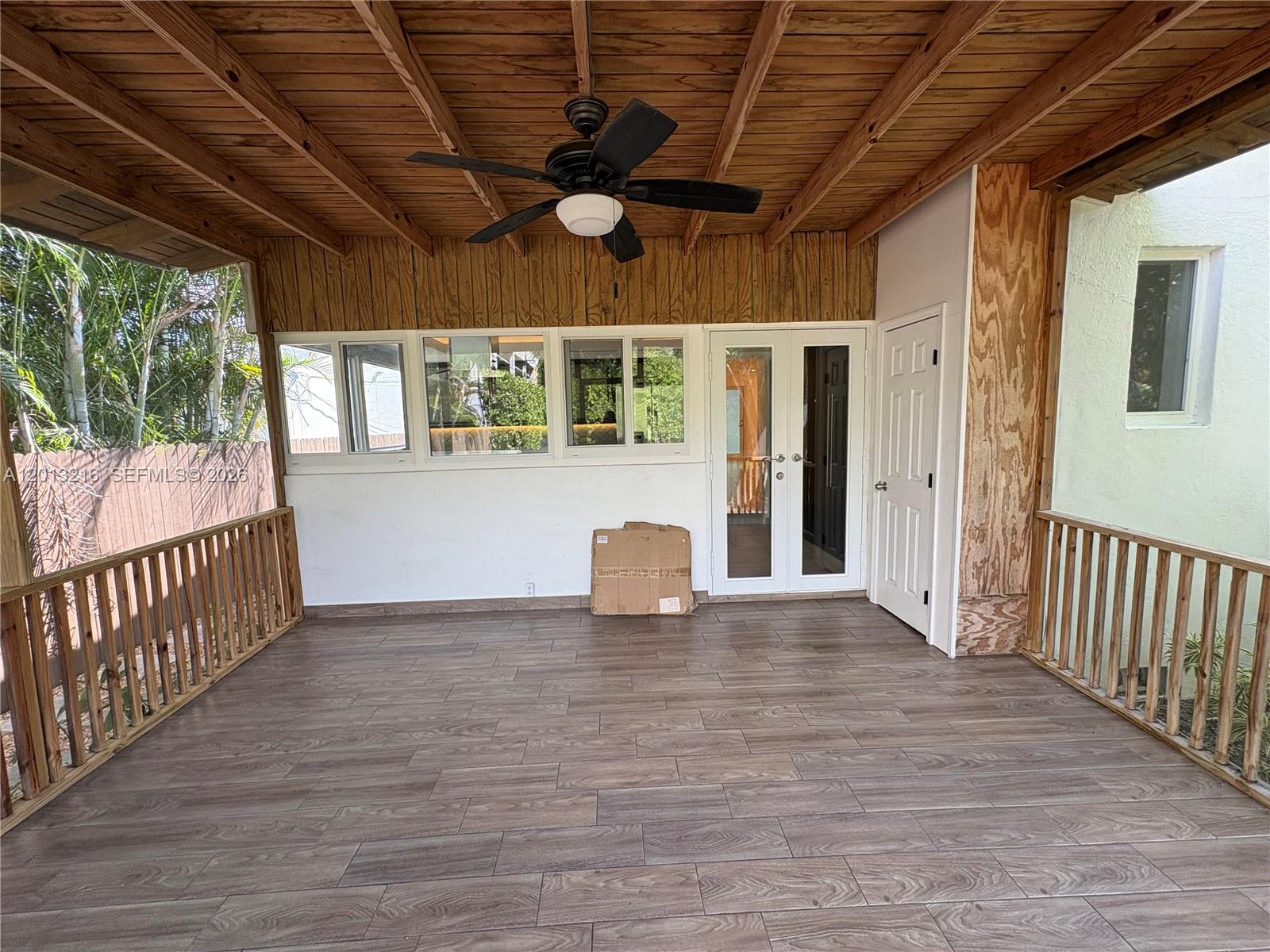 250 Southwest 19th Road Miami, FL 33129 - Photo 15 of 22 a view of empty room with wooden floor and fan