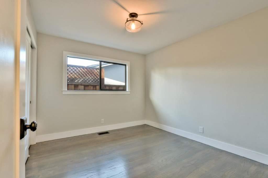 3959 Paladin Drive San Jose, CA 95124 - Photo 16 of 31 an empty room with windows and fan