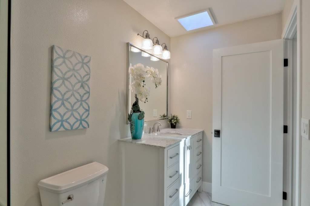 3959 Paladin Drive San Jose, CA 95124 - Photo 21 of 31 a bathroom with a sink vanity mirror and toilet
