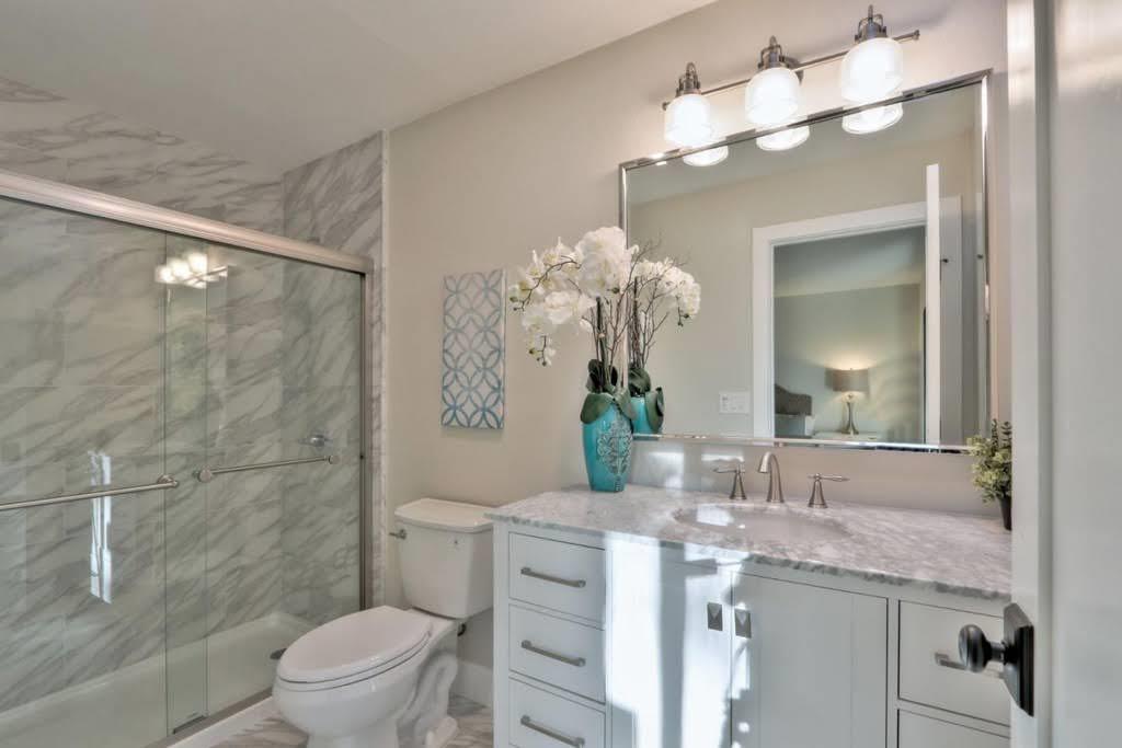 3959 Paladin Drive San Jose, CA 95124 - Photo 22 of 31 a bathroom with a granite countertop sink a toilet and a mirror