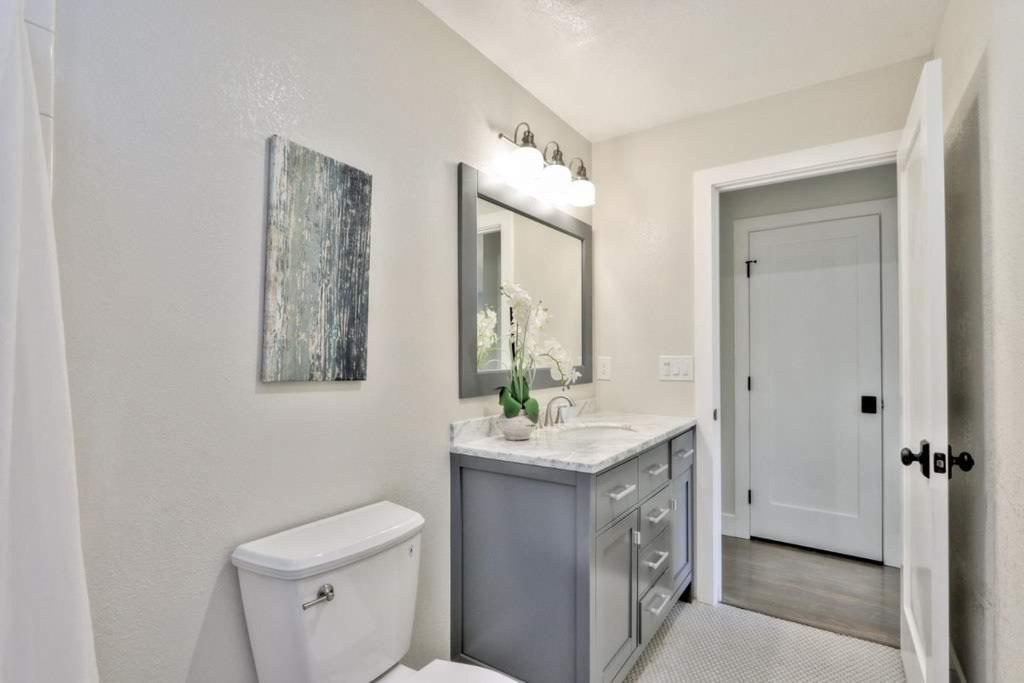 3959 Paladin Drive San Jose, CA 95124 - Photo 23 of 31 a bathroom with a sink vanity mirror and toilet