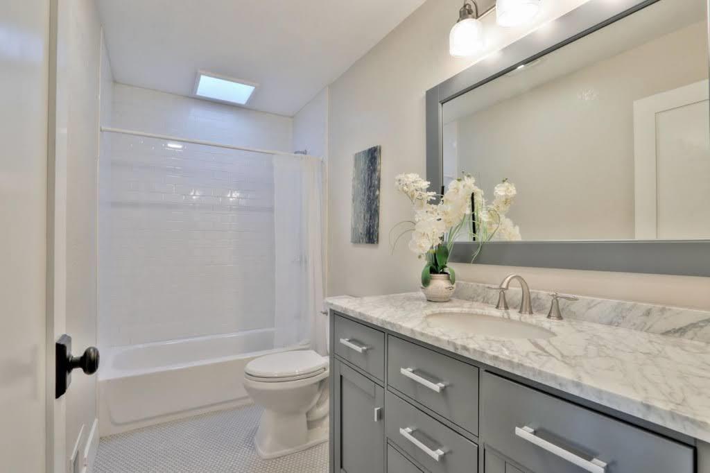 3959 Paladin Drive San Jose, CA 95124 - Photo 24 of 31 a bathroom with a granite countertop toilet a sink and a mirror