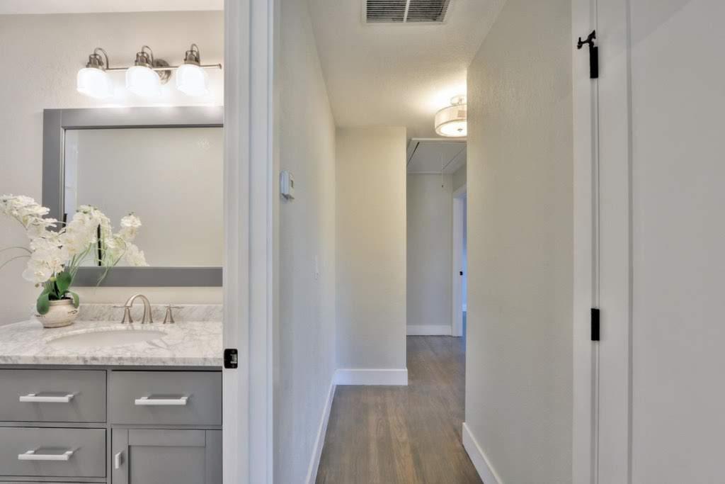 3959 Paladin Drive San Jose, CA 95124 - Photo 25 of 31 a bathroom with a granite countertop sink and a mirror