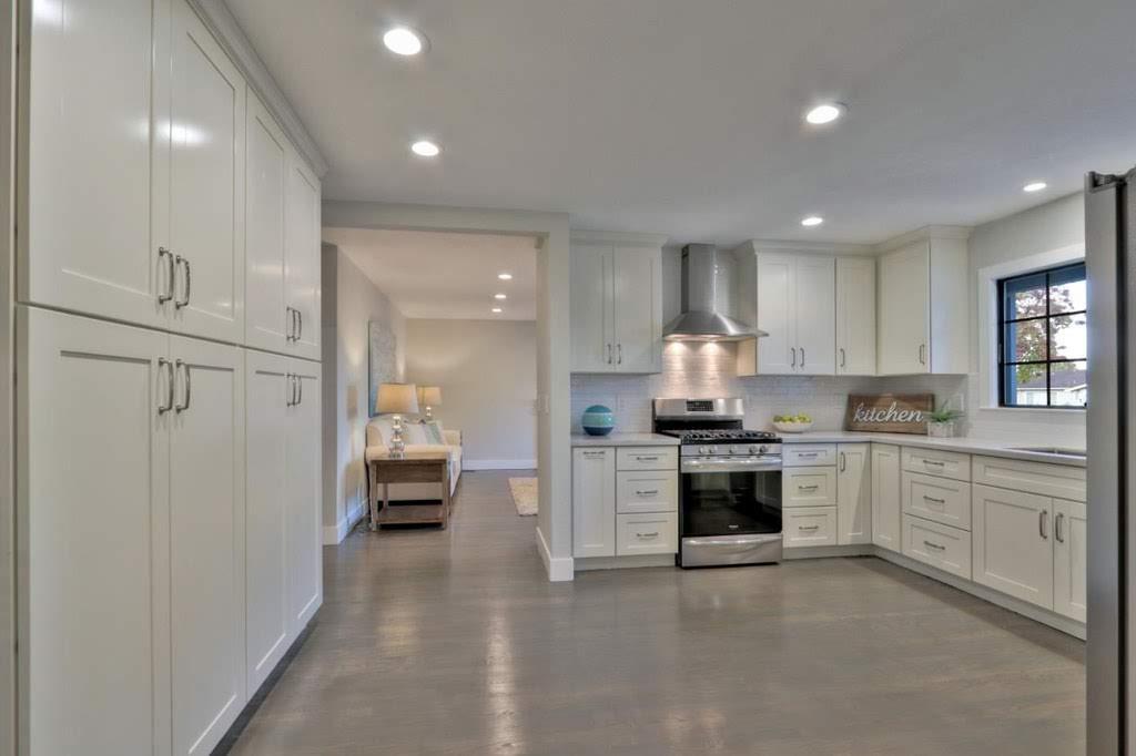 3959 Paladin Drive San Jose, CA 95124 - Photo 10 of 31 a kitchen with white cabinets and stainless steel appliances