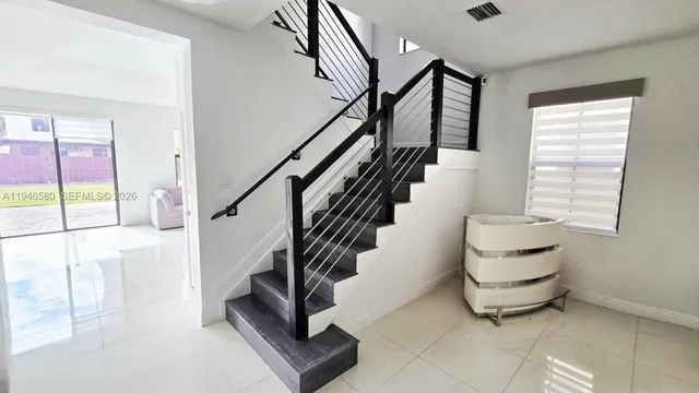 a white toilet sitting next to a bath tub