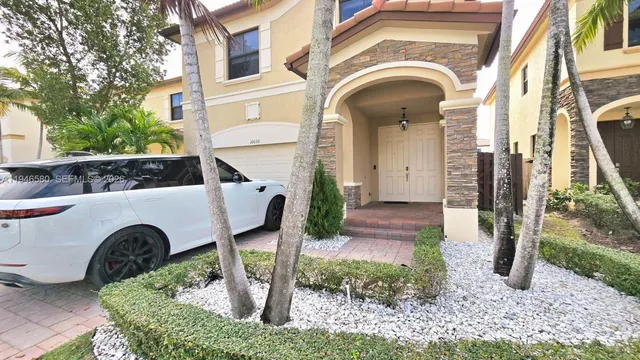 a view of en suite bathroom with a tub and a large window