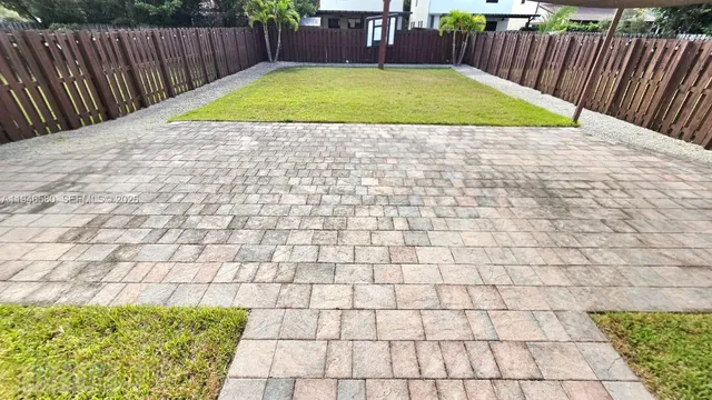 a view of a backyard with a tub