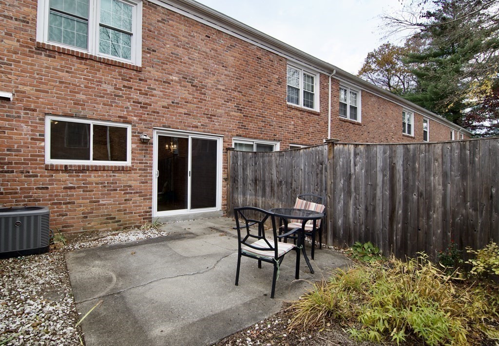 a backyard of a house with outdoor seating