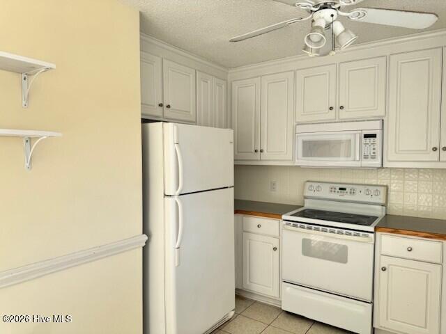 567 Ridge Drive Winterville, NC 28590 - Photo 21 of 47 Appliances include: refrigerator, microwave over electric range, and dishwasher.