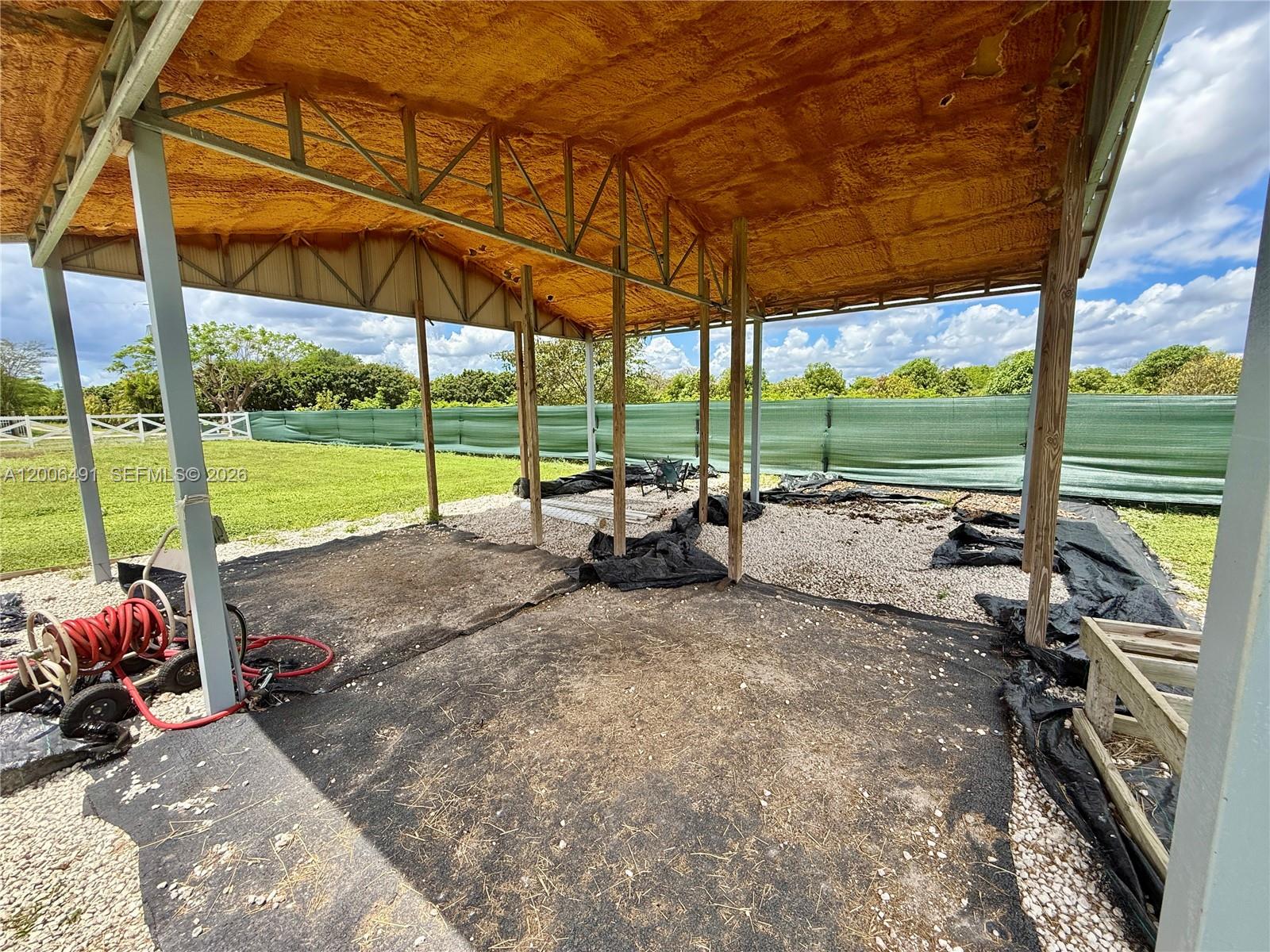 22275 Southwest 256th Street Homestead, FL 33031 - Photo 56 of 57 a view of a backyard with sitting area