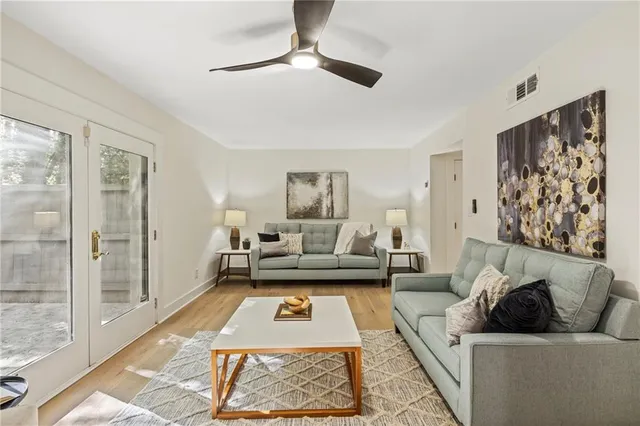 a living room with furniture and a rug