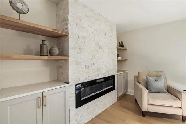 a living room with furniture a wooden floor and a window