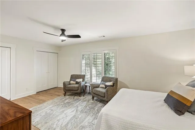a bedroom with a bed and glass window