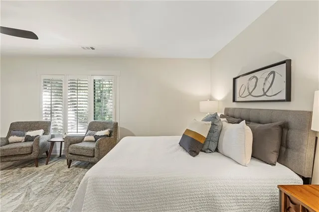 a bedroom with a bed and a night stand