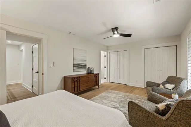 a bedroom with a bed and dresser