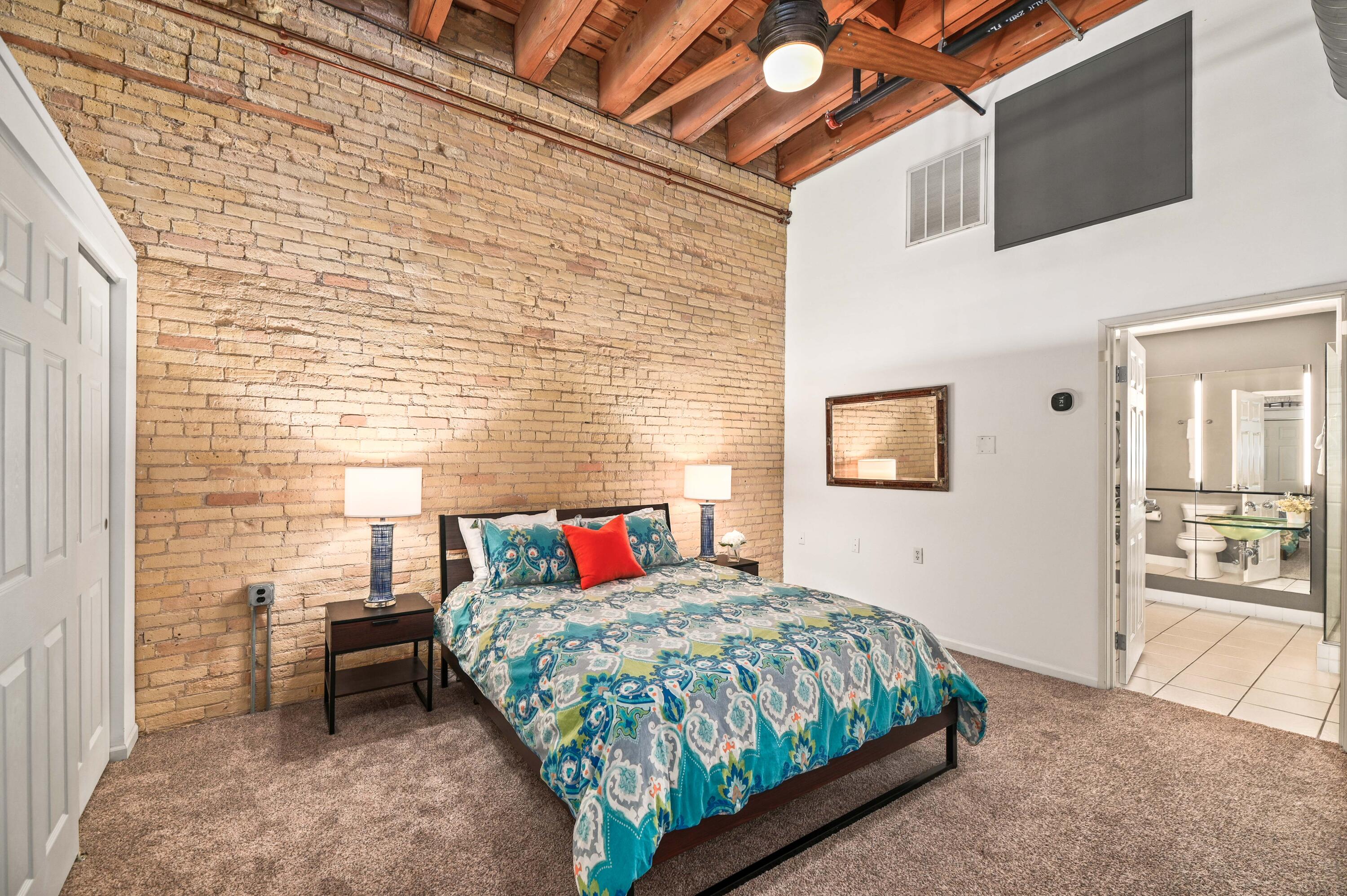 205 North Water Street, Unit 200 Milwaukee, WI 53202 - Photo 6 of 24 Primary Bedroom with Exposed Brick