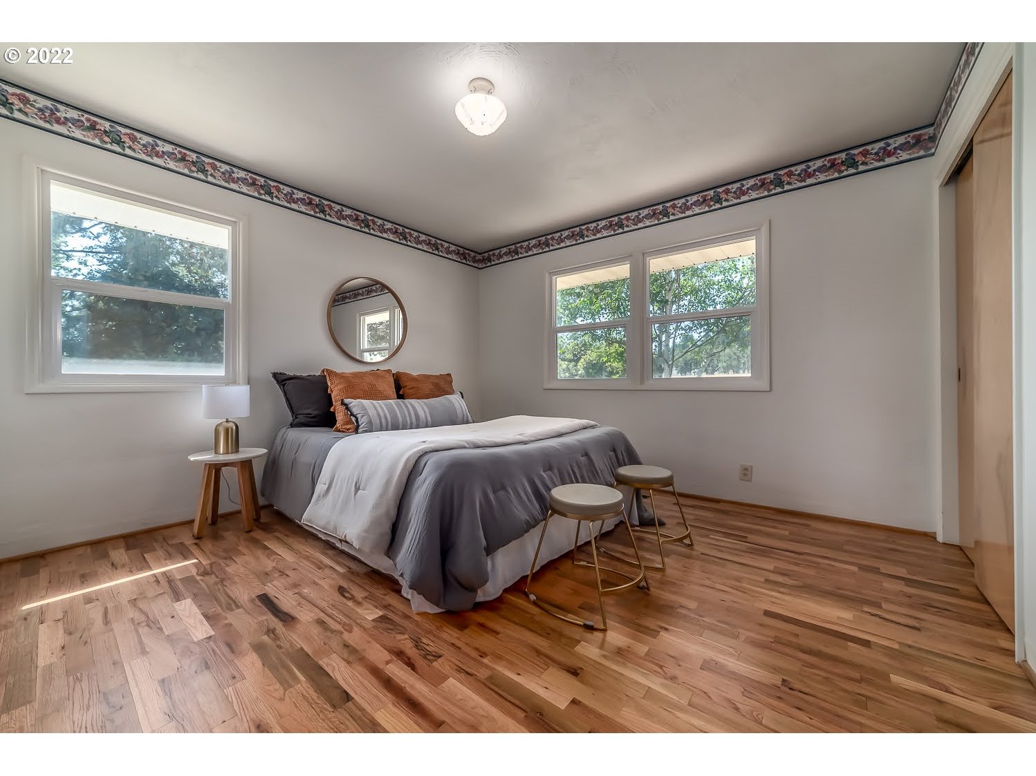 83849 Mill Road Dexter, OR 97431 - Photo 8 of 29 a bedroom with a bed and wooden floor