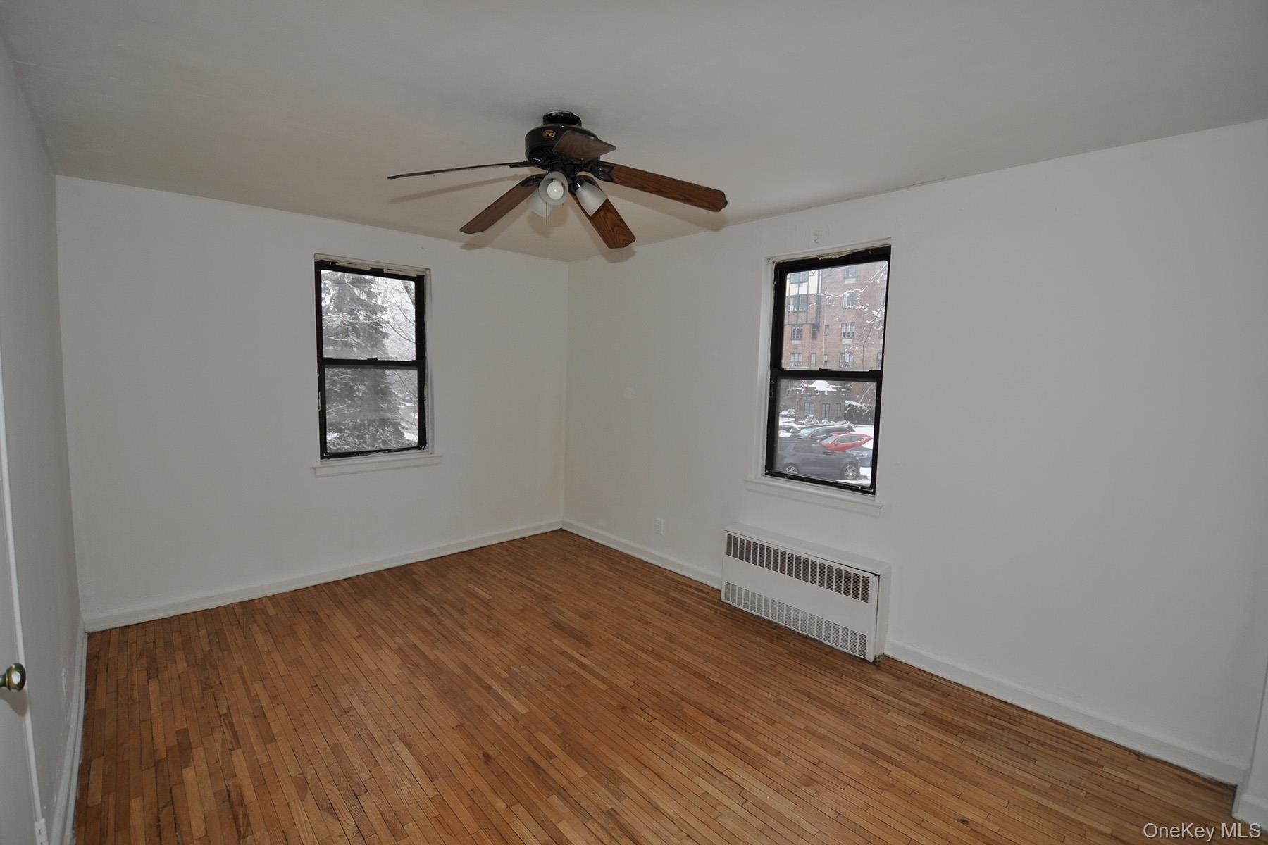 142 Garth Road, Unit 1R Scarsdale, NY 10583 - Photo 9 of 12 wooden floor in an empty room