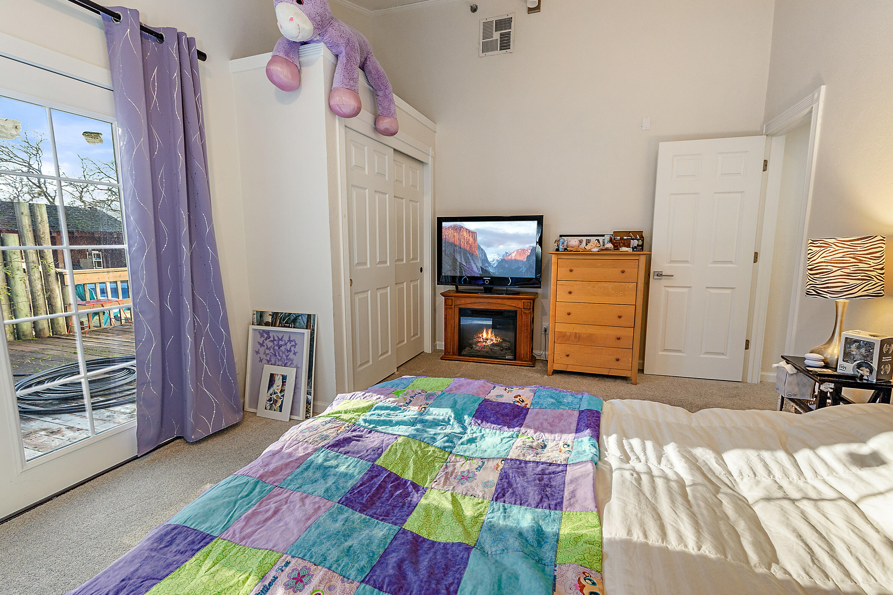 6150 Tolo Road Central Point, OR 97502 - Photo 32 of 51 a bedroom with a bed and a flat screen tv
