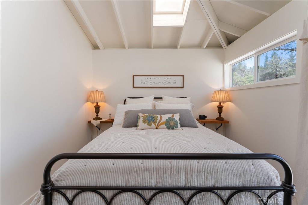 30429 Ridgewood Drive Potter Valley, CA 95469 - Photo 19 of 38 a bedroom with a bed and wooden floor
