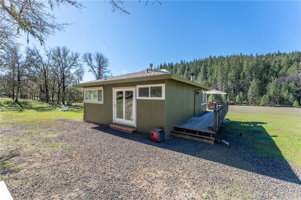 30429 Ridgewood Drive Potter Valley, CA 95469 - Photo 23 of 38 a view of a house with a yard