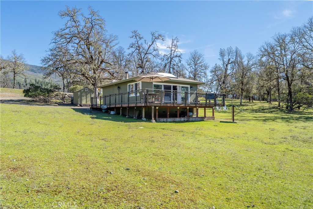 30429 Ridgewood Drive Potter Valley, CA 95469 - Photo 4 of 38 a view of a house with a yard patio and swimming pool
