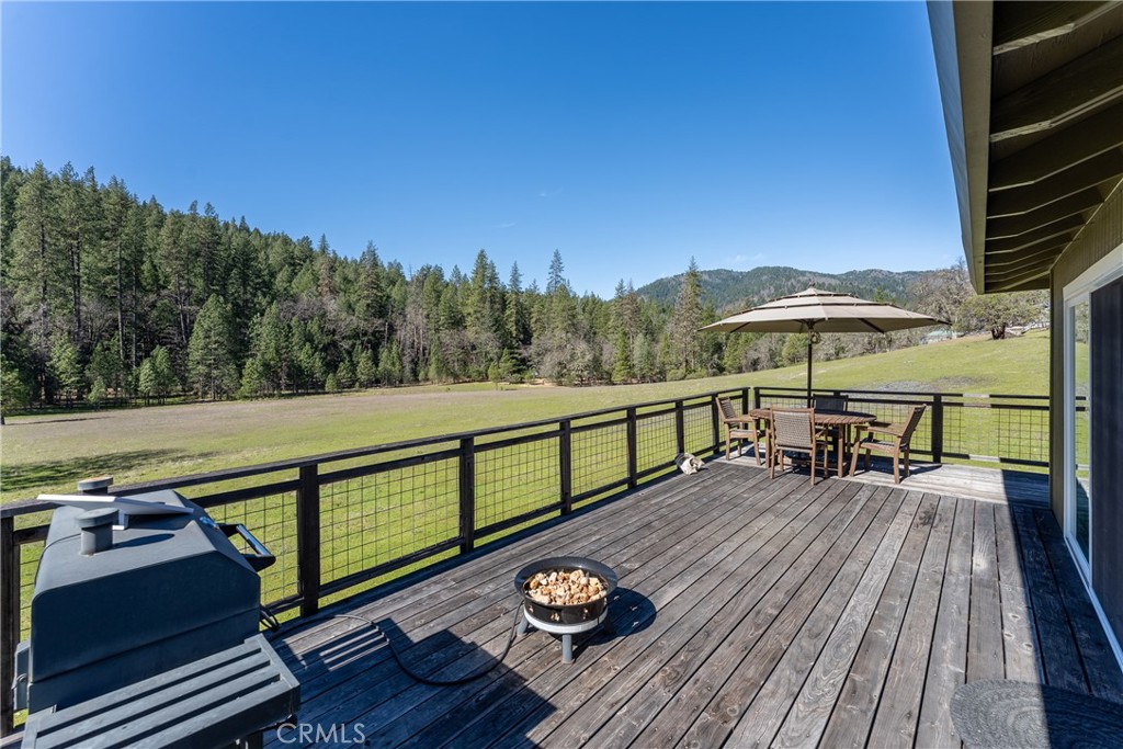 30429 Ridgewood Drive Potter Valley, CA 95469 - Photo 6 of 38 a view of a balcony with chairs and wooden floor