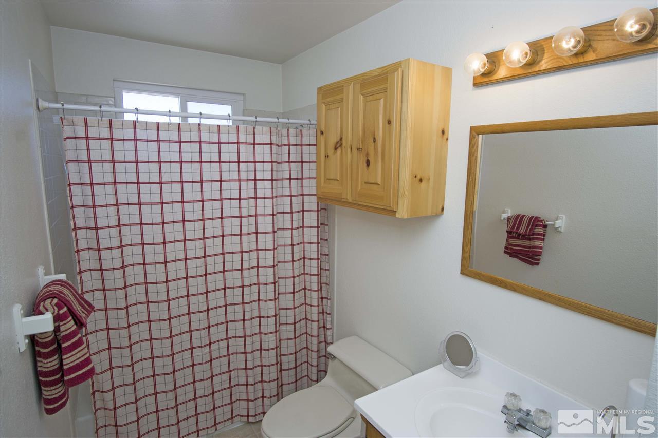 17360 Egret Lane Reno, NV 89508 - Photo 8 of 14 a bathroom with a sink toilet and shower