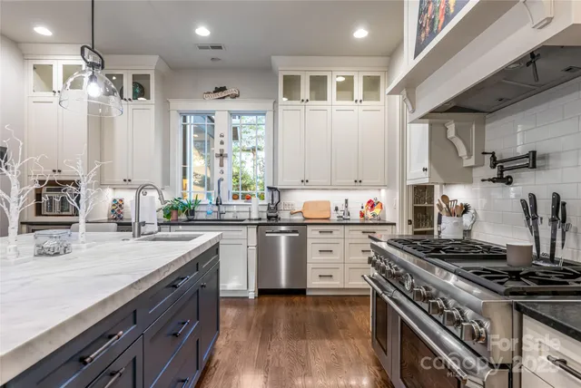 a kitchen with a stove and a sink