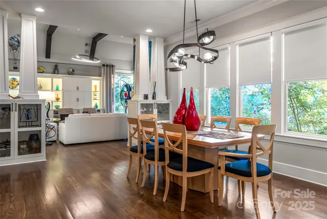 a view of a dining room with furniture window and wooden floor